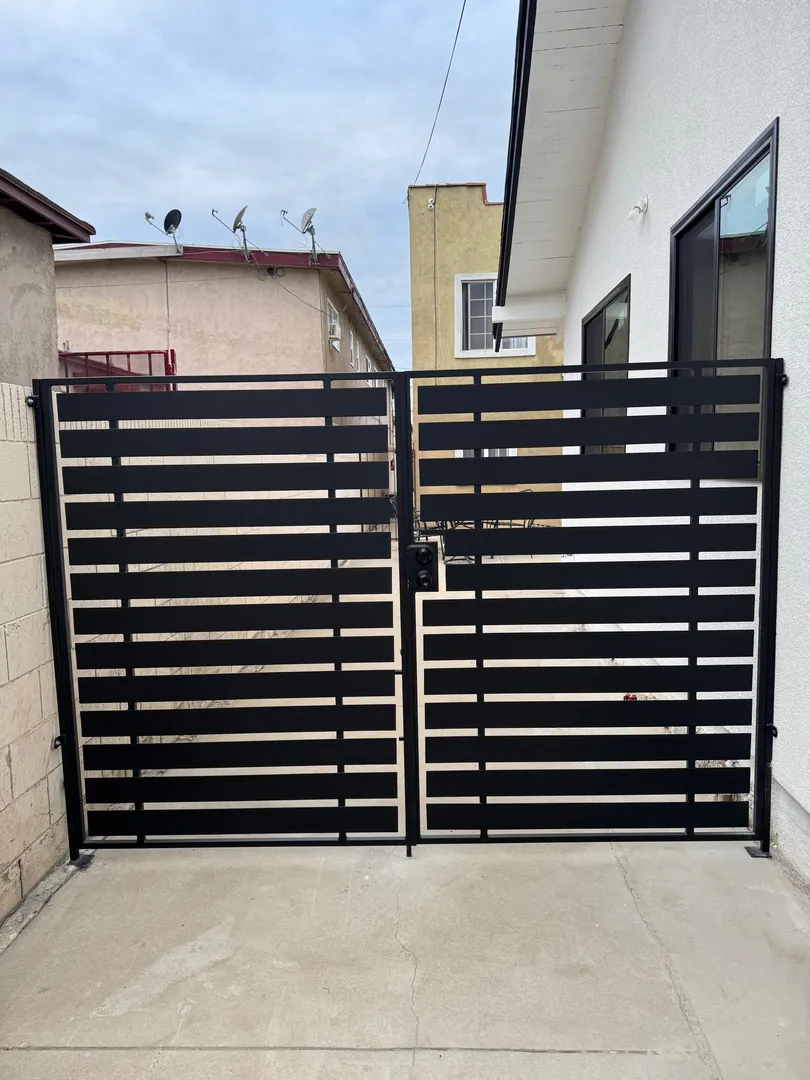 Black double horizontal custom driveway gate