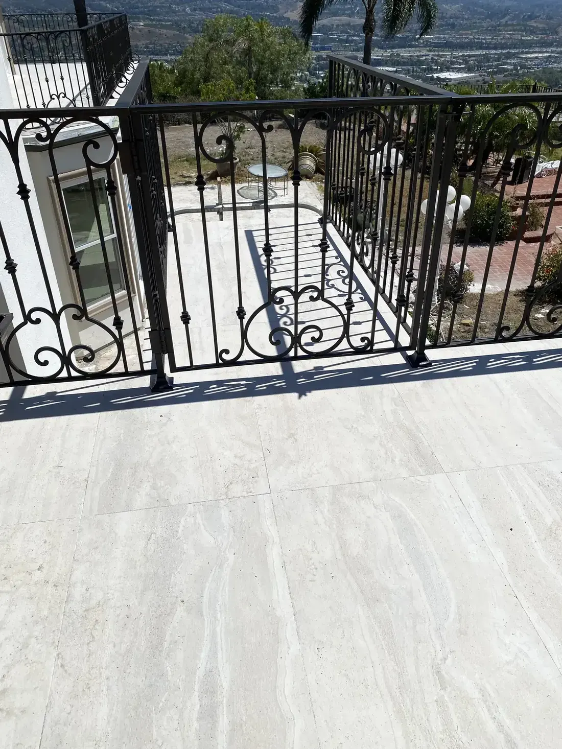 Ornate iron balcony railing with decorative scrollwork